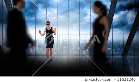Composite image of business people walking in a blur 11621246