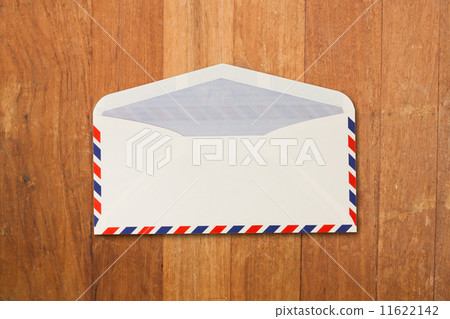 Envelope by air mail isolated on wood 11622142