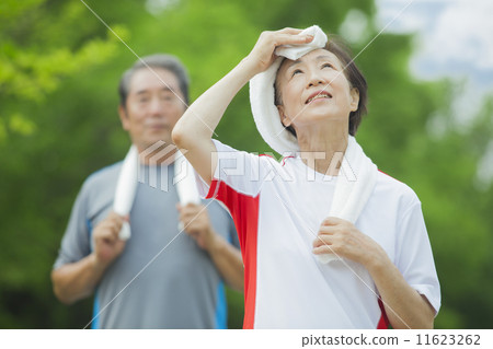 A woman sweating with a towel 11623262