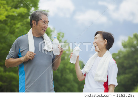 Senior drinking water of plastic bottles 11623282