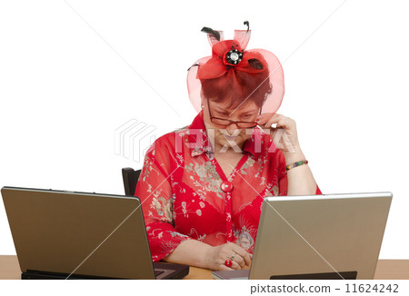 Woman in glasses staring at the laptop screen Woman in glasses staring at the laptop screen 11624242