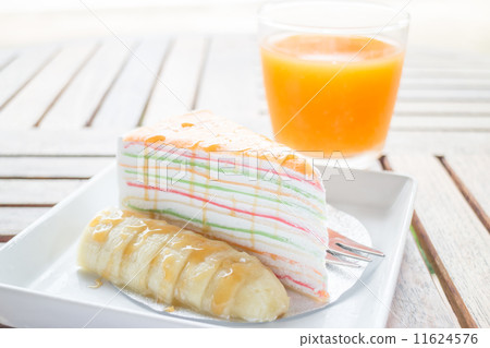 Energy charge dessert with banana caramel crepe cake and fresh o 11624576