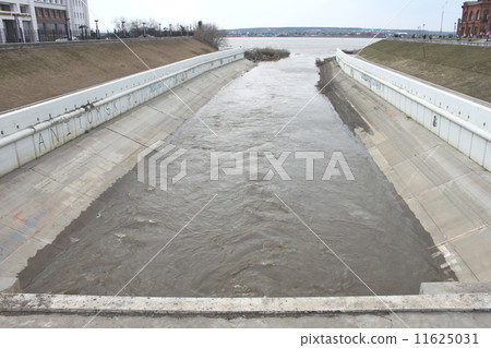 The Ushayka River flows into the Tom River through the central part of Tomsk in Russia The Ushayka River flows into the Tom River through the central part of Tomsk in Russia 11625031