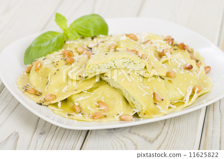 Ravioli with basil & ricotta. Butter, pine nuts & sage sauce Ravioli with basil & ricotta. Butter, pine nuts & sage sauce 11625822