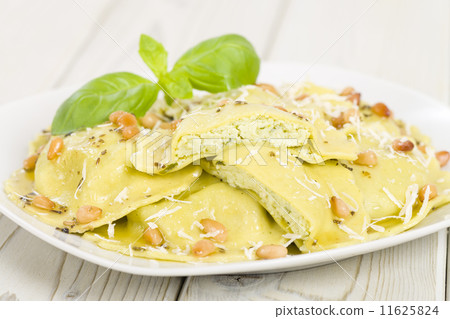 Ravioli with basil & ricotta. Butter, pine nuts & sage sauce Ravioli with basil & ricotta. Butter, pine nuts & sage sauce 11625824