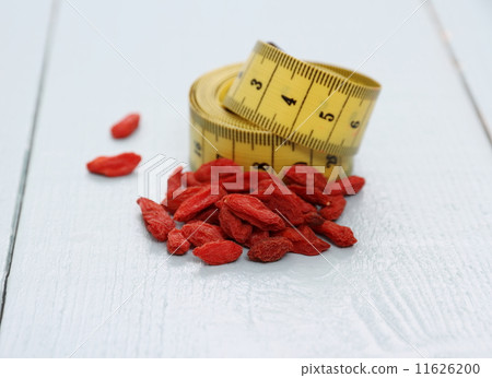 Goji berries and tape measure, concept of health 11626200