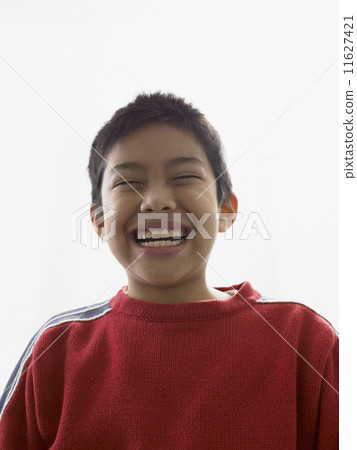 Portrait of young boy smiling 11627421