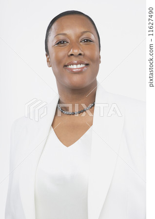 Studio shot of African woman smiling Studio shot of African woman smiling 11627490