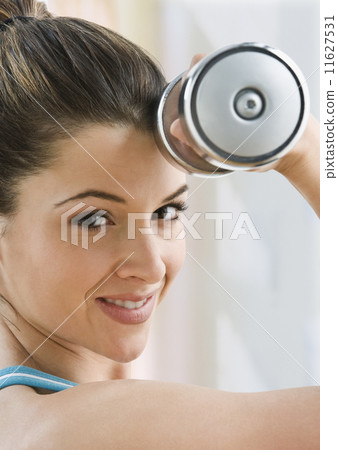 Woman lifting weights Woman lifting weights 11627531