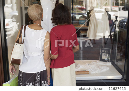 Senior African American women window shopping 11627613