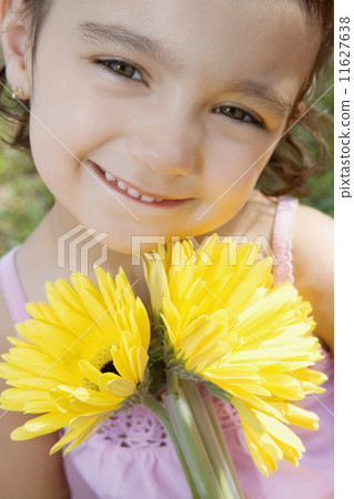 Girl holding flowers 11627638