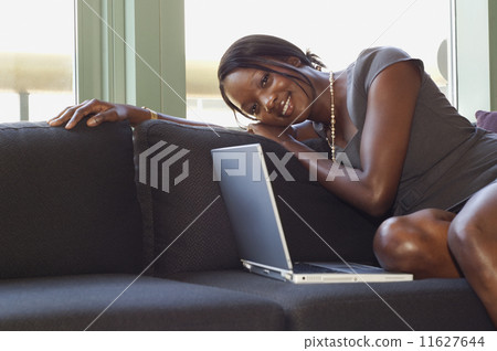 African businesswoman sitting on sofa 11627644