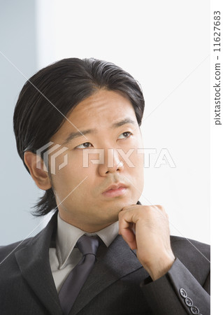 Asian businessman thinking Asian businessman thinking 11627683