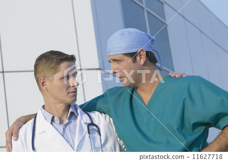 Two male doctors looking at each other 11627718