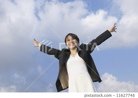 Asian businesswoman with arms outstretched 11627748