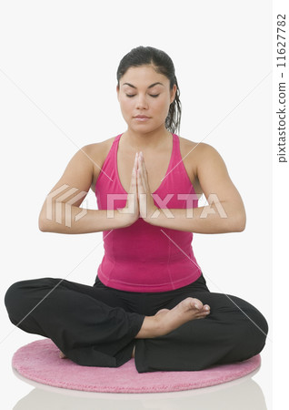 Teen girl meditating in a yoga position 11627782