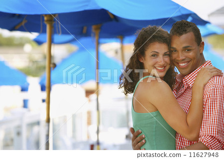 Young couple hugging at beach Young couple hugging at beach 11627948