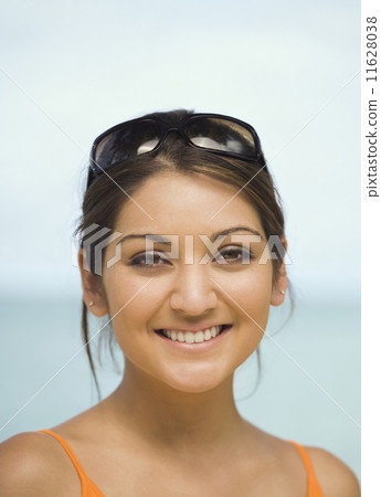 Asian woman with sunglasses on head Asian woman with sunglasses on head 11628038
