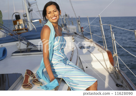 Asian woman sitting on sailboat 11628090