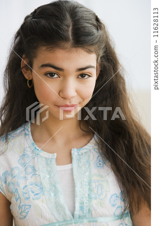 Portrait of Hispanic teenaged girl 11628113
