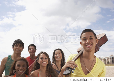 Multi-ethnic friends with guitar 11628152