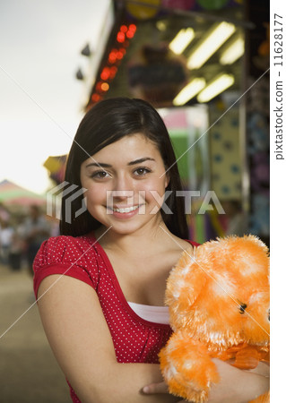 Mixed Race teenaged girl at carnival  11628177