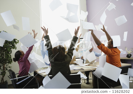 Businesspeople cheering at meeting 11628202