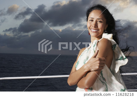 Hispanic woman with water in background 11628218
