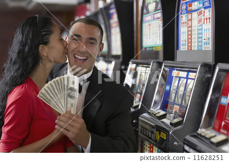 Hispanic couple holding money 11628251