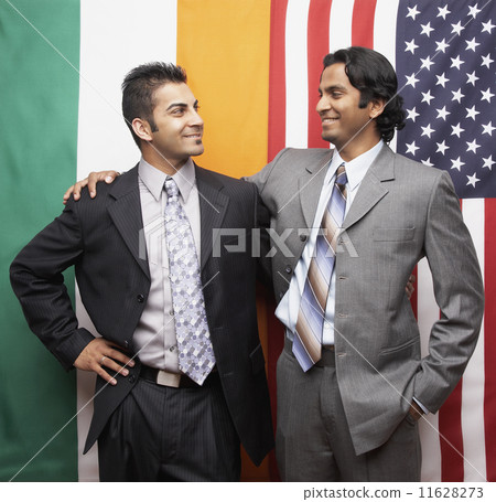 Indian businessmen in front of flags 11628273