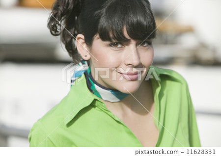 Hispanic woman wearing scarf around neck 11628331