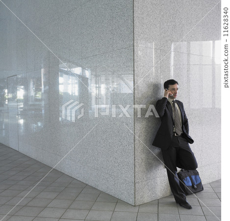 Businessman talking on cell phone 11628340