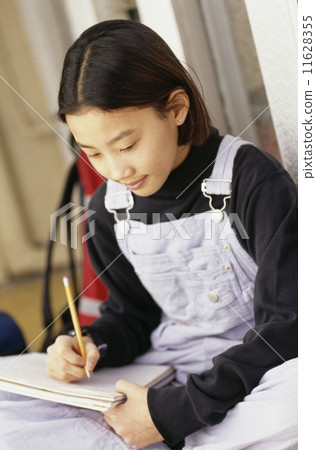 Asian girl doing homework 11628355