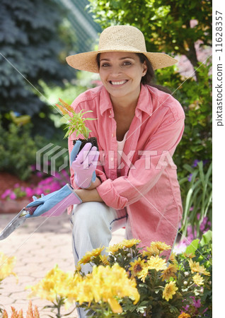 Portrait of woman gardening 11628357