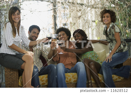 South American friends toasting at party South American friends toasting at party 11628512
