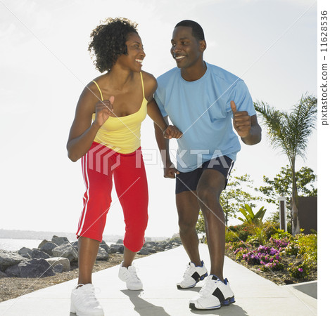 African couple wearing athletic gear 11628536