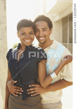 African American couple hugging 11628544