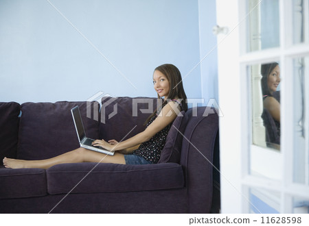 African woman typing on laptop African woman typing on laptop 11628598