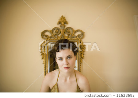 Close up of woman in front of mirror Close up of woman in front of mirror 11628692