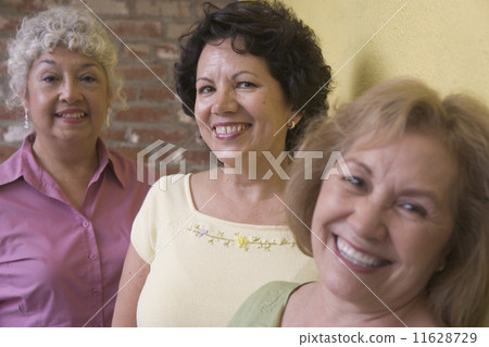 Portrait of three woman smiling 11628729