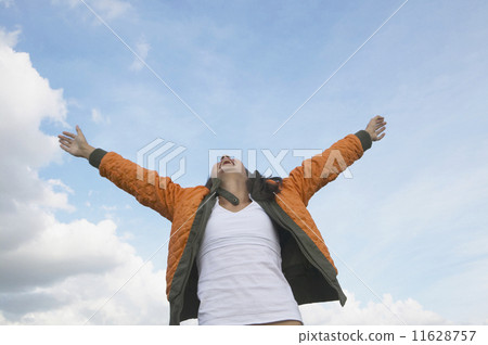 Hispanic girl with arms outstretched Hispanic girl with arms outstretched 11628757
