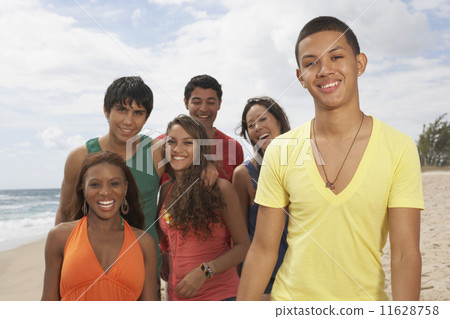 Multi-ethnic friends at beach 11628758