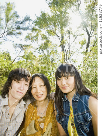 Asian mother and adult children hugging Asian mother and adult children hugging 11628779