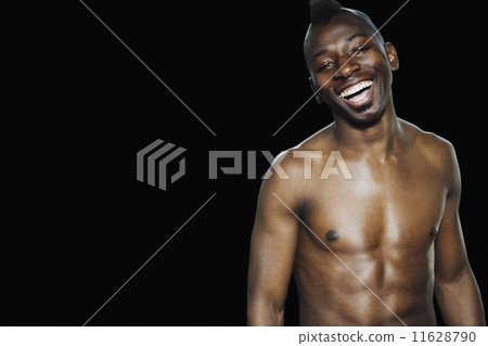 Studio shot of bare-chested African man Studio shot of bare-chested African man 11628790
