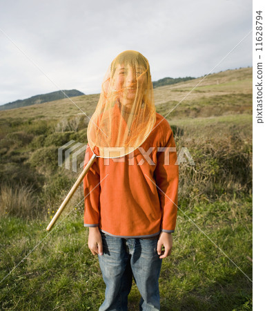 Hispanic boy with net over head Hispanic boy with net over head 11628794