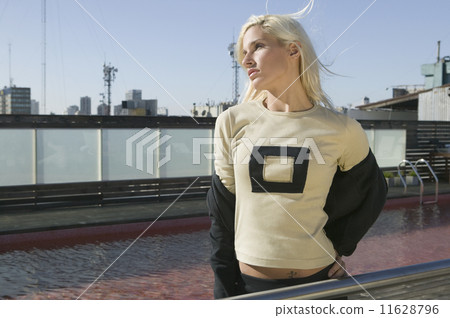 Young woman next to swimming pool 11628796