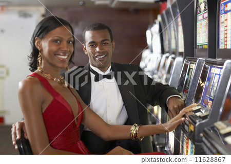 Couple next to slot machines 11628867