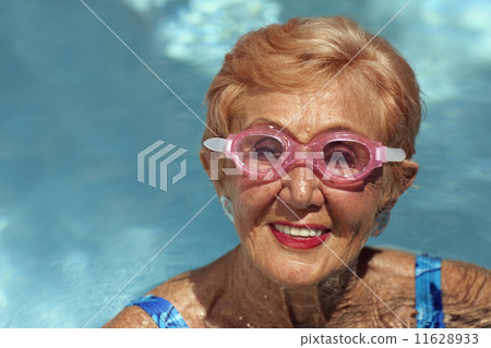 Senior woman in swimming pool Senior woman in swimming pool 11628933