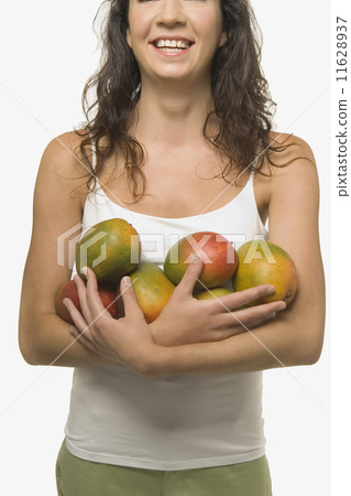 Young woman holding fruit 11628937