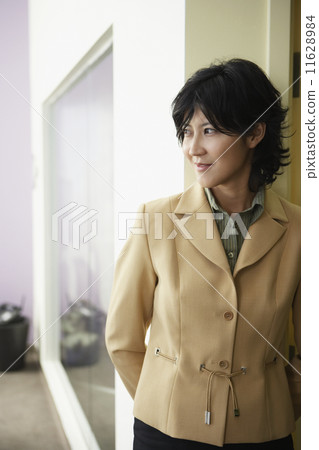 Kazakh woman standing in doorway 11628984